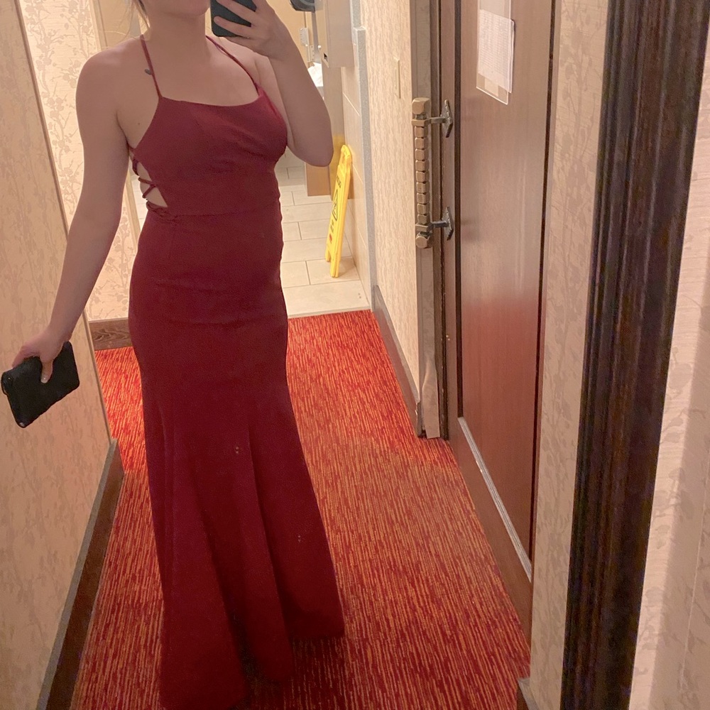 Only worn once! Beautiful red dress with ties in the back to adjust.